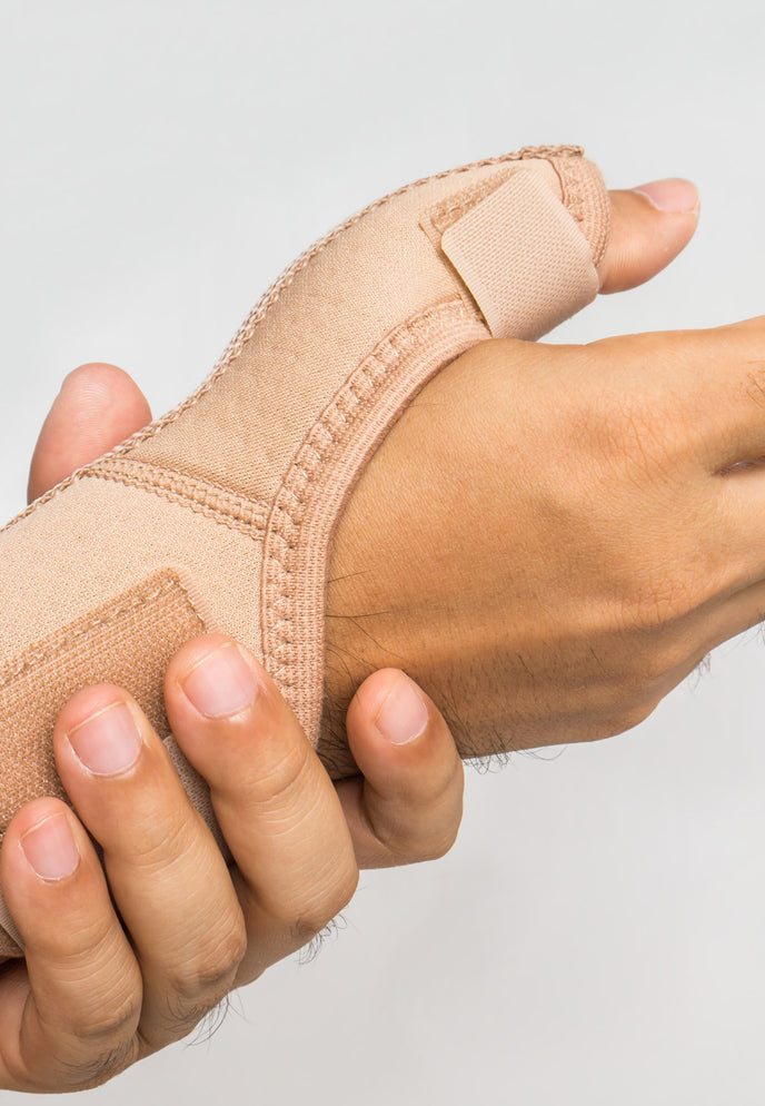 person with bad wrist pain wearing a brace 
